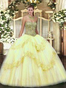 Light Yellow Sleeveless Beading and Appliques Floor Length Quinceanera Gowns