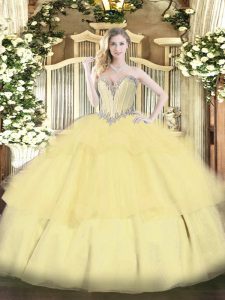 Sleeveless Tulle Floor Length Lace Up Quinceanera Dress in Gold with Beading and Ruffled Layers